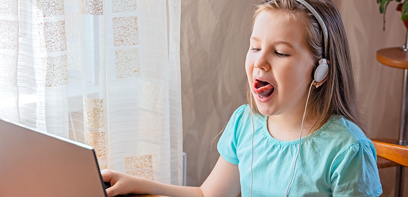 speech-language pathologist treats girl over telehealth