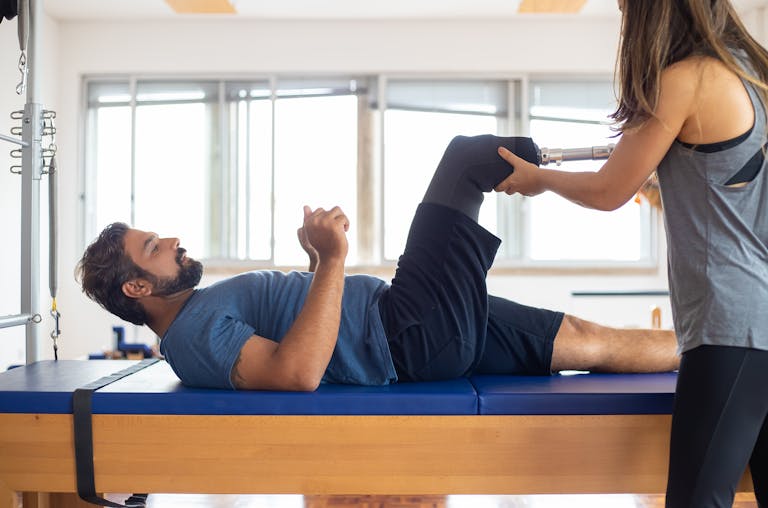 a man undergoes physical therapy for amputated leg