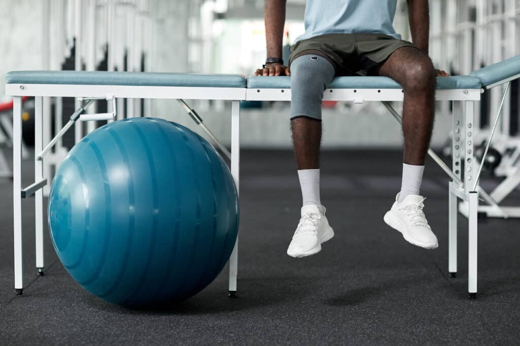Physical therapy technician set up exercise equipment
