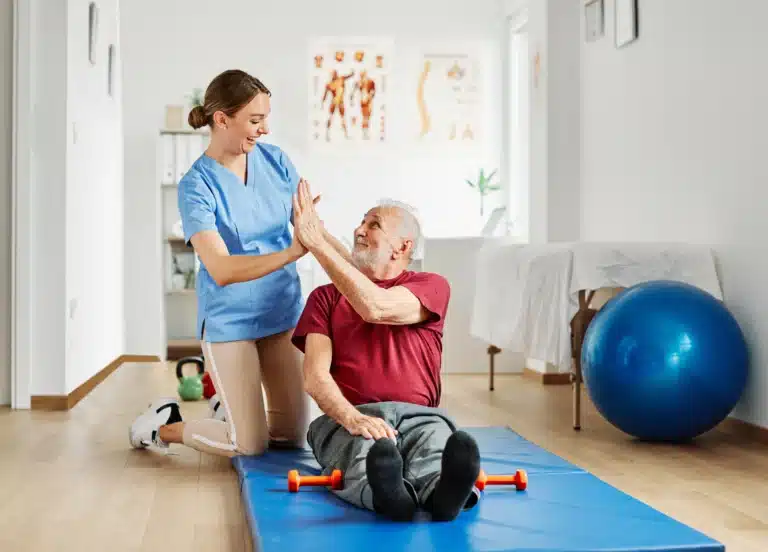 A patient and PT high five as they develop their relationship and increase patient retention