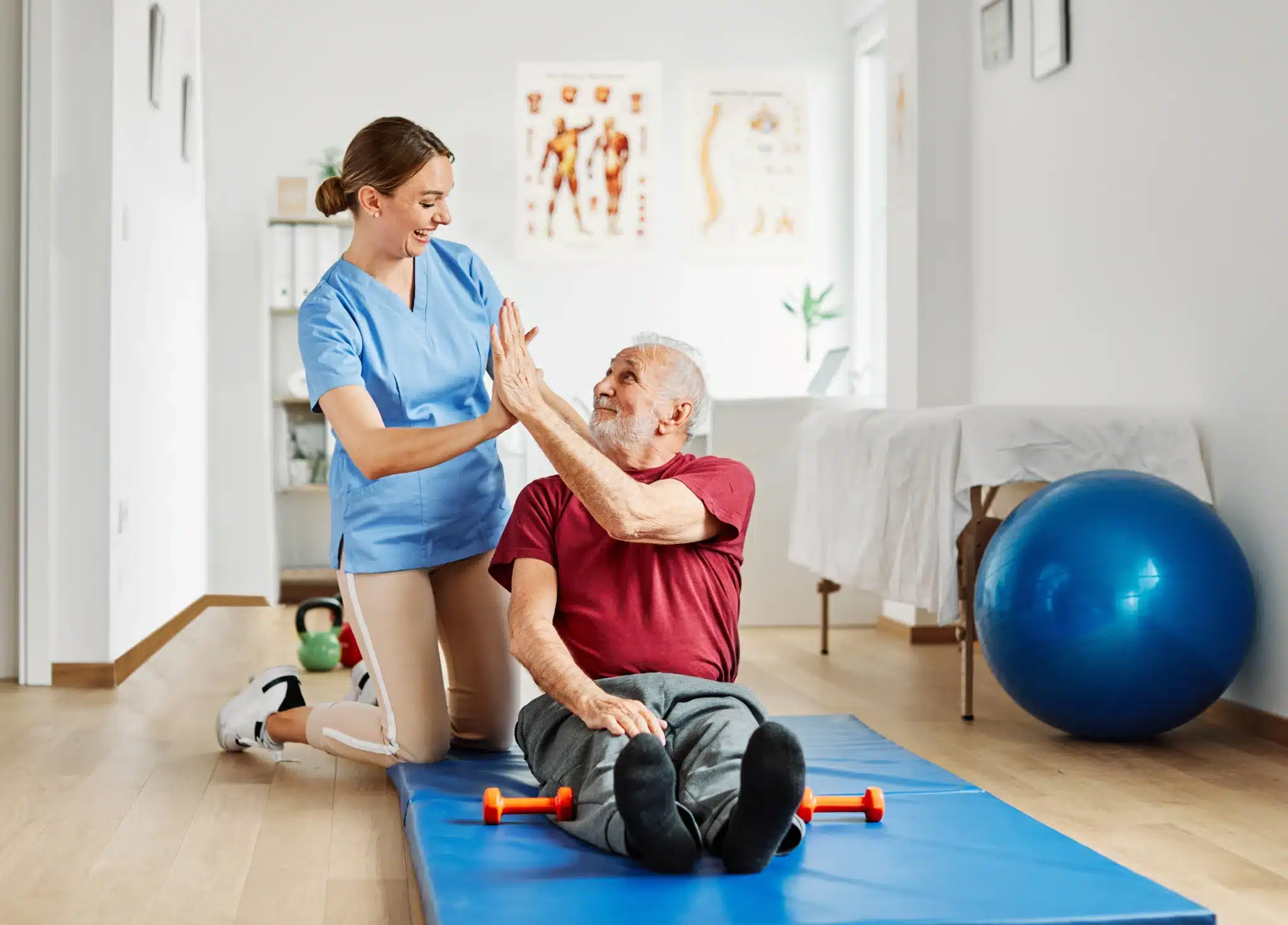A patient and PT high five as they develop their relationship and increase patient retention