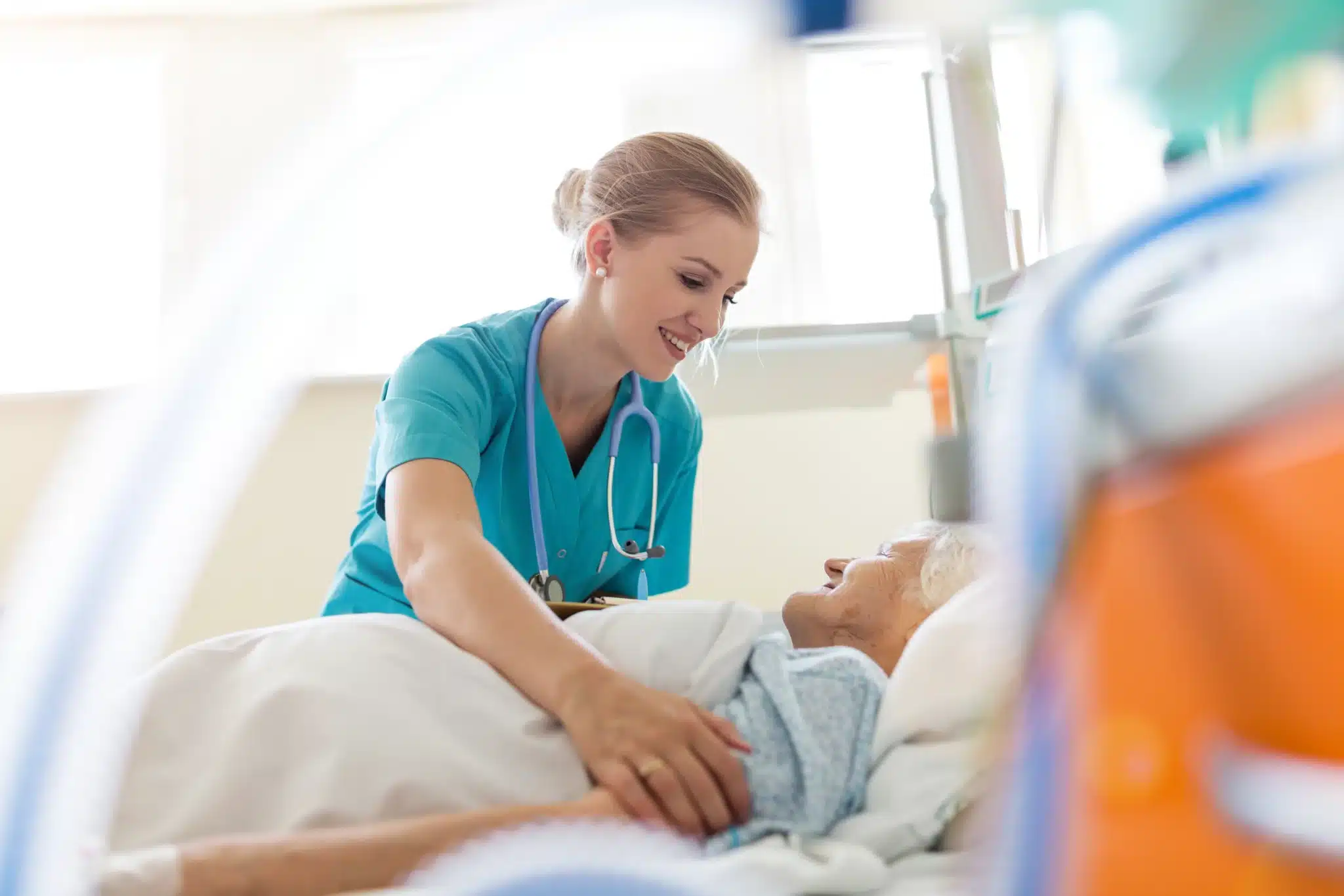 Hospital nurse caring for patient